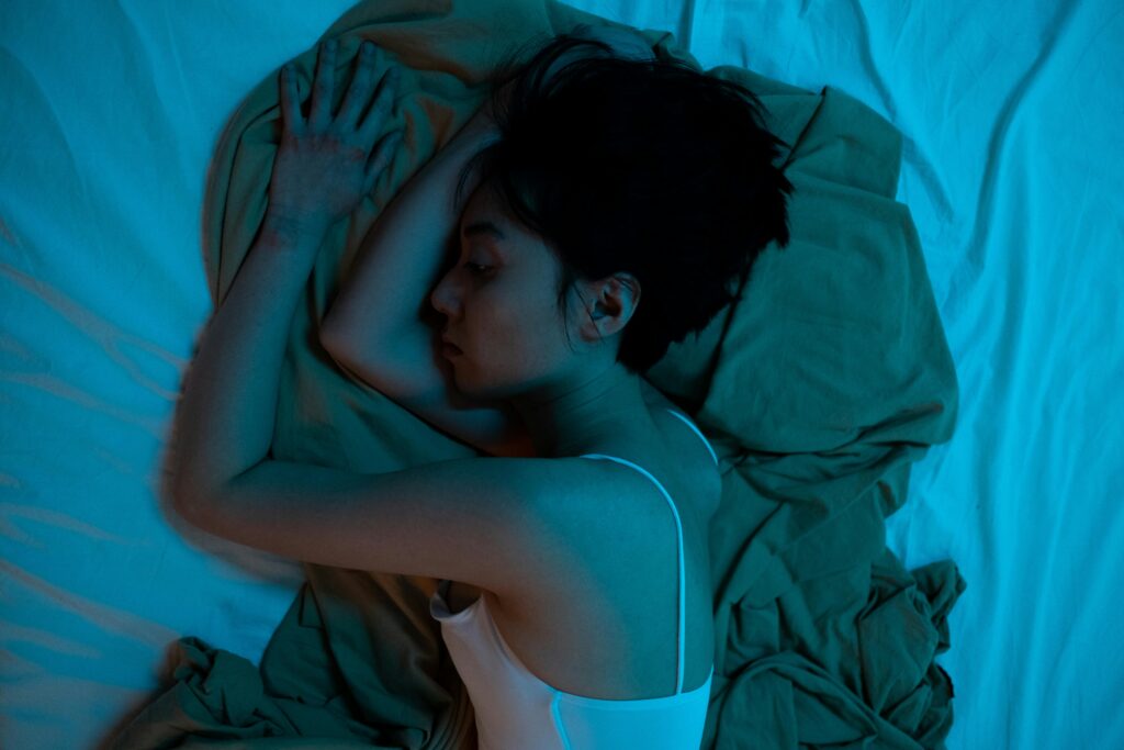 woman lying on the bed deeply thinking
