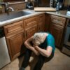 Portrait of a Woman Crying on the Kitchen Floor